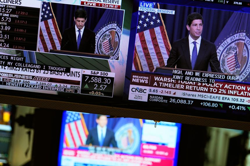 Screens display a news conference held by Federal Reserve chairman Kevin Warsh on the floor of the New York Stock Exchange in New York, on Wednesday, September 16.