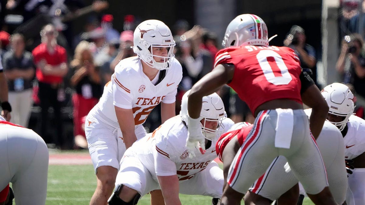 Texas Longhorns quarterback Arch Manning (16) tries to read the Ohio State Buckeyes defense in the second quarter of their game at Ohio Stadium in Columbus, Ohio on Aug 30, 2025.