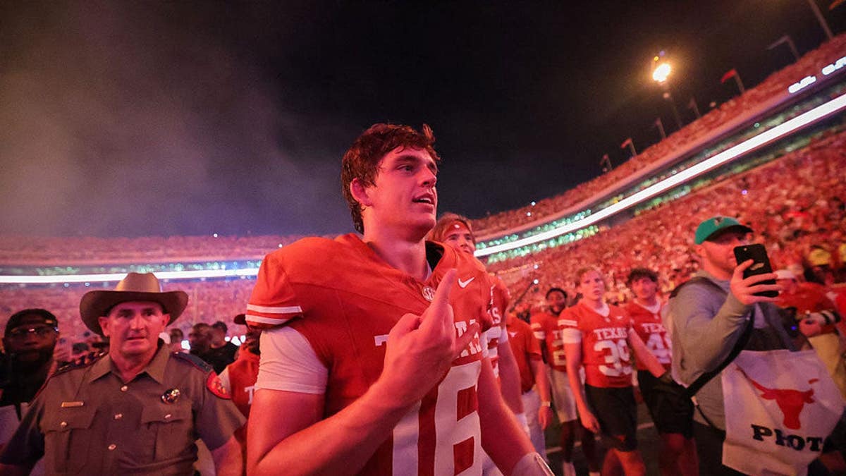 Arch Manning celebrates after a win at Darrell K Royal-Texas Memorial Stadium.