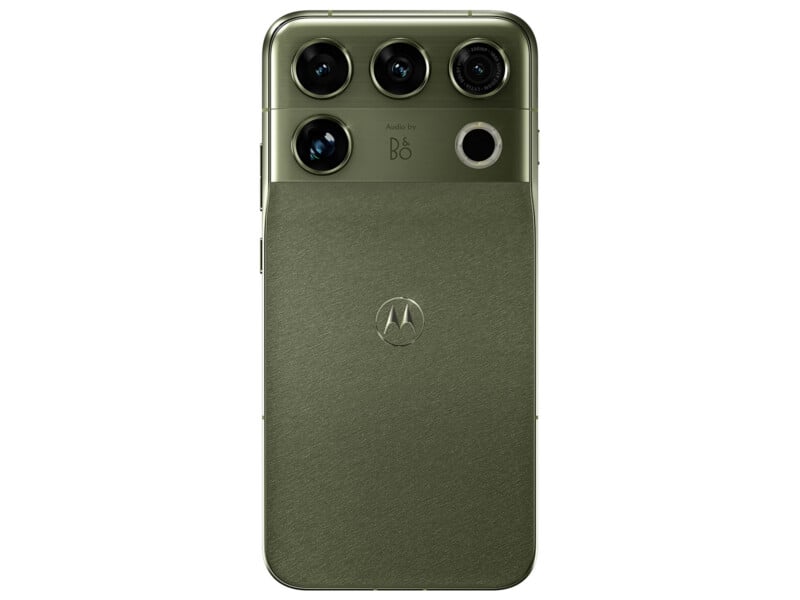 A green smartphone with a textured back, a Motorola logo in the center, and a horizontal camera module at the top featuring four lenses and "Audio by B&O" branding.