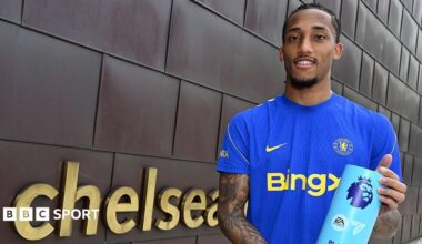 Joao Pedro holding his Player of the Month award