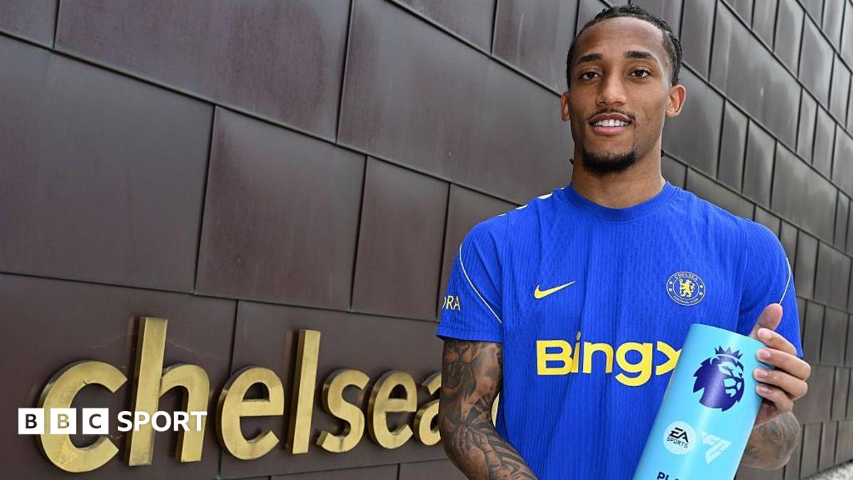 Joao Pedro holding his Player of the Month award