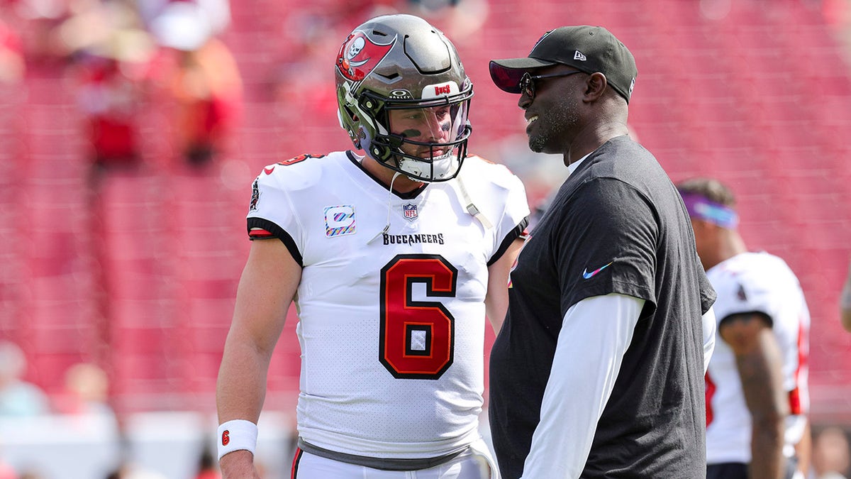 Todd Bowles and Baker Mayfield before a game against the Atlanta Falcons at Raymond James Stadium.