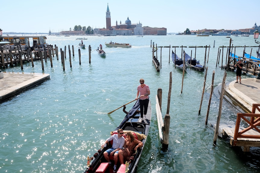A couple on a gondola ride.