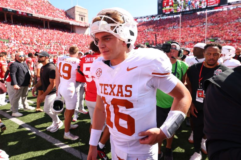 Arch Manning #16 of the Texas Longhorns leaves the field after a 14-7 loss to the Ohio State Buckeyes at Ohio Stadium, in Columbus, Ohio, on August 30, 2025