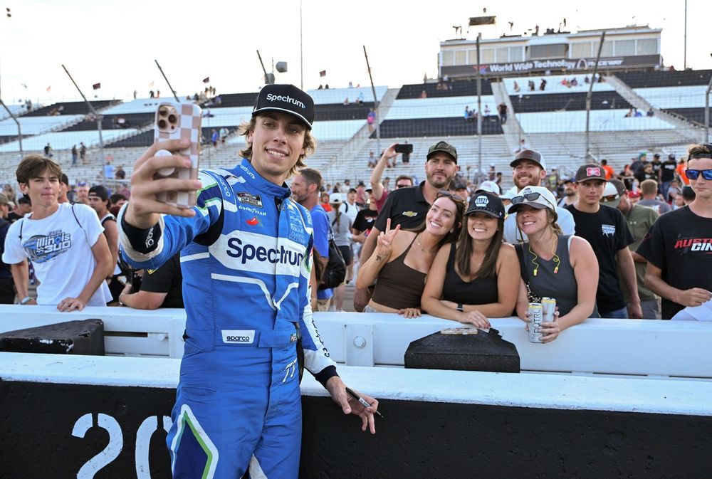 Carson Hocevar with fans, No. 77 Spire Motorsports Chevrolet