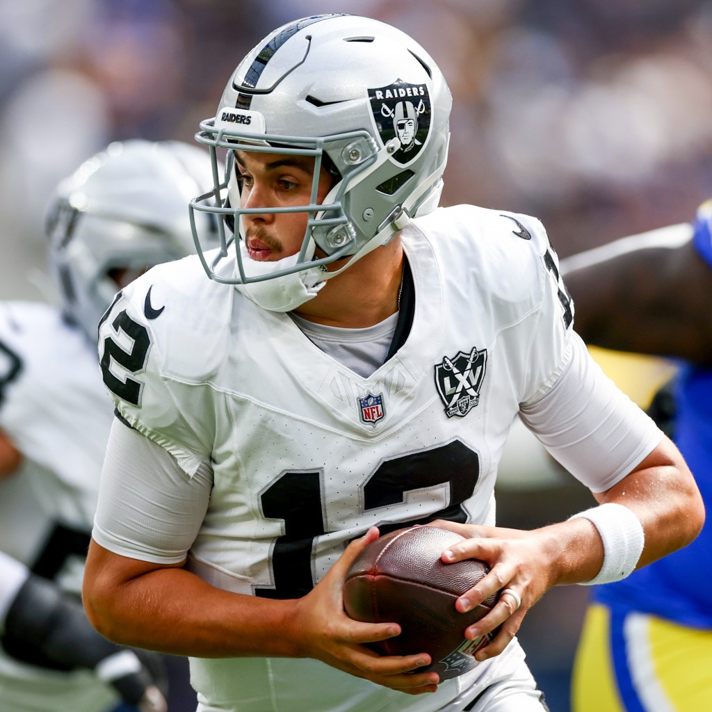 Aidan O'Connell #12 of the Las Vegas Raiders runs with the ball against the Los Angeles Rams during the first quarter at SoFi Stadium on October 20, 2024 in Inglewood, California.