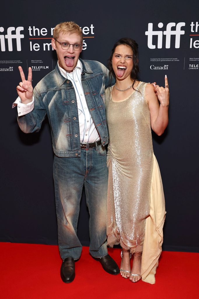 Curry Barker and Inde Navarrette pose playfully sticking out their tongues at the 'Obsession' Special Event, 2026 Toronto International Film Festival.