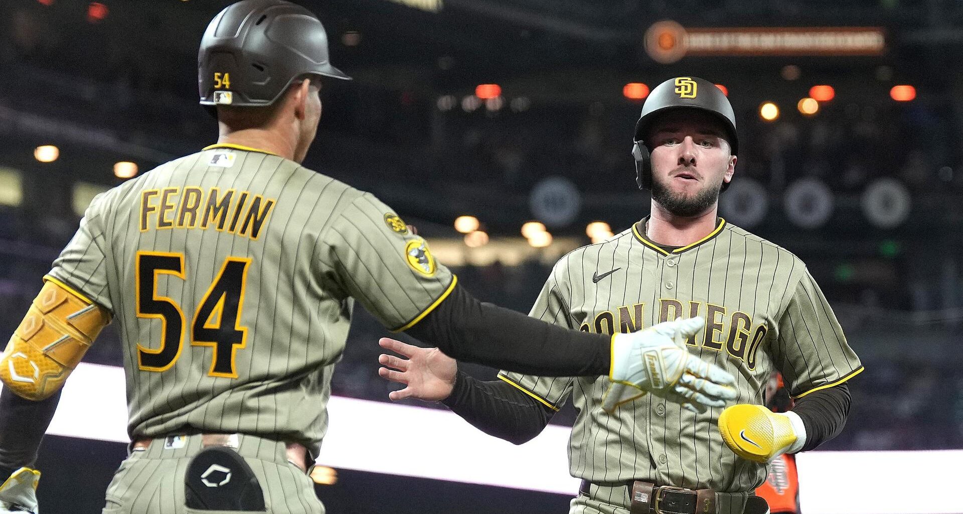 Ray gets 100th career win as Padres hold off Giants 7-5 to maintain wild-card edge