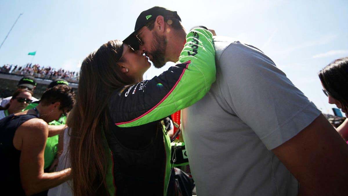 Danica Patrick kisses Aaron Rodgers before the Indianapolis 500 at Indianapolis Motor Speedway.