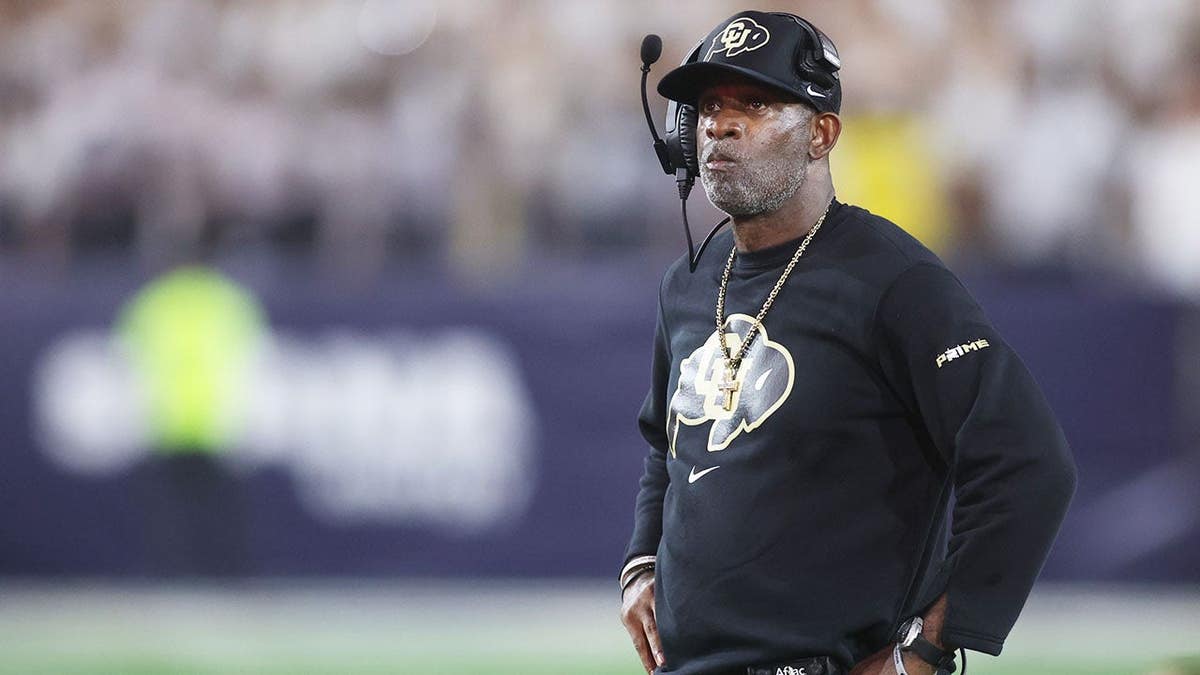 Deion Sanders reacts during the first half at Bobby Dodd Stadium.