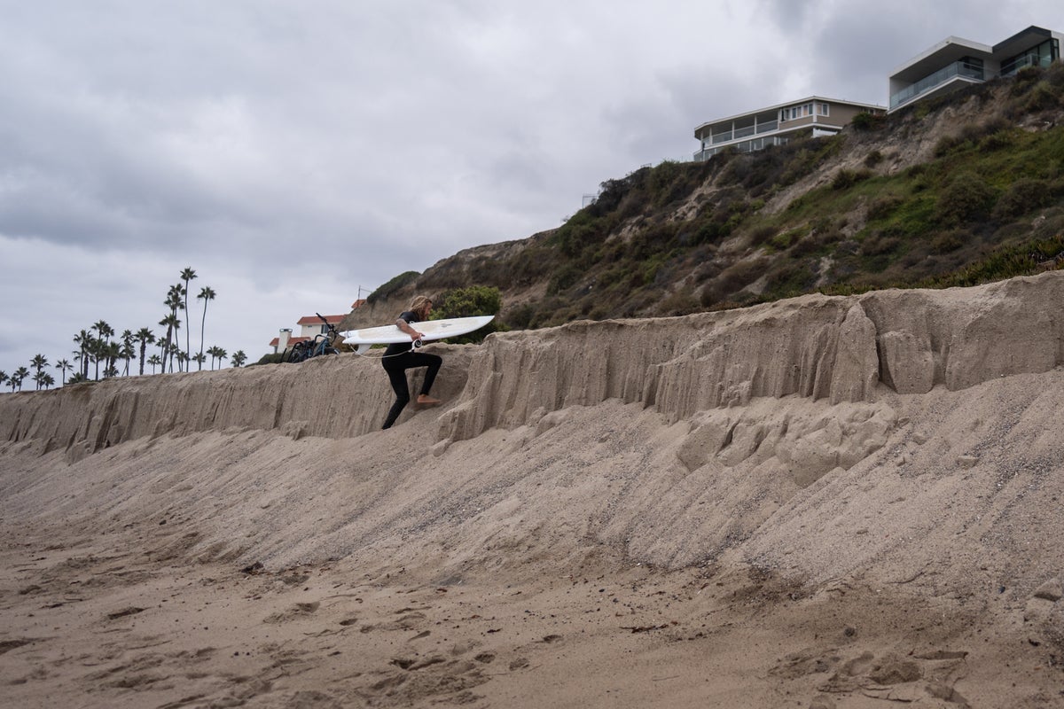 Sea level rise is reshaping a California beach town and threatening a key rail line