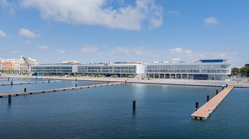 blue spiral staircase anchors ERRE’s harbor-side workspace in valencia - 1
