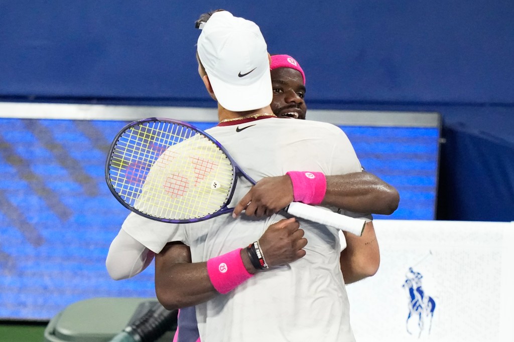 Frances Tiafoe, right, embraces Martin Damm after Tiafoe won their match.