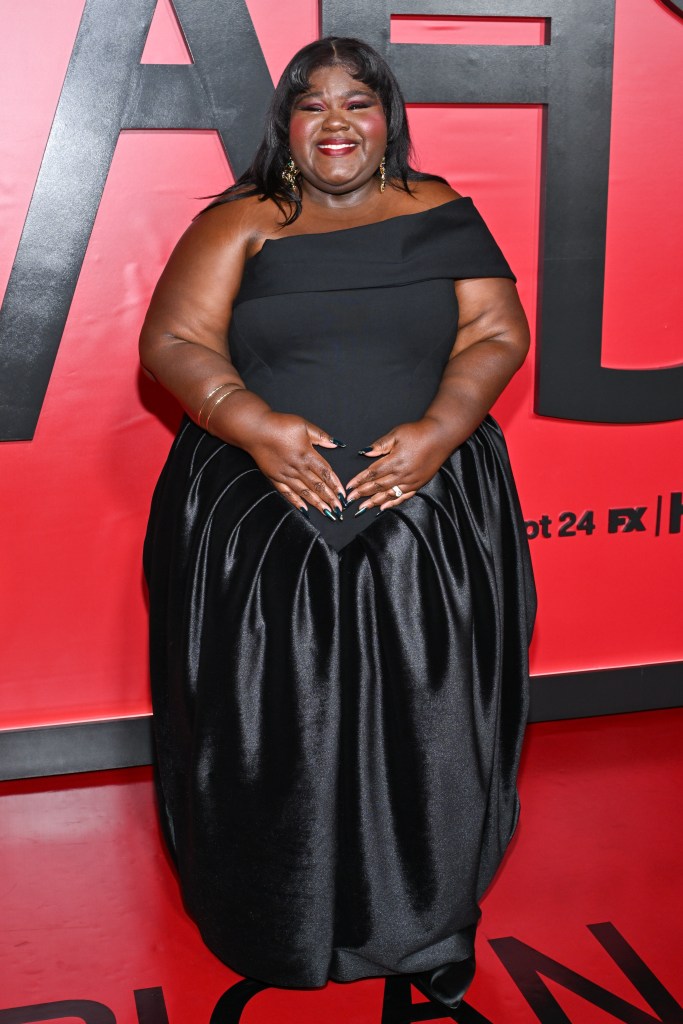 Gabourey Sidibe smiles while attending the premiere of FX's "American Horror Story: 13" at The Hotel Chelsea.