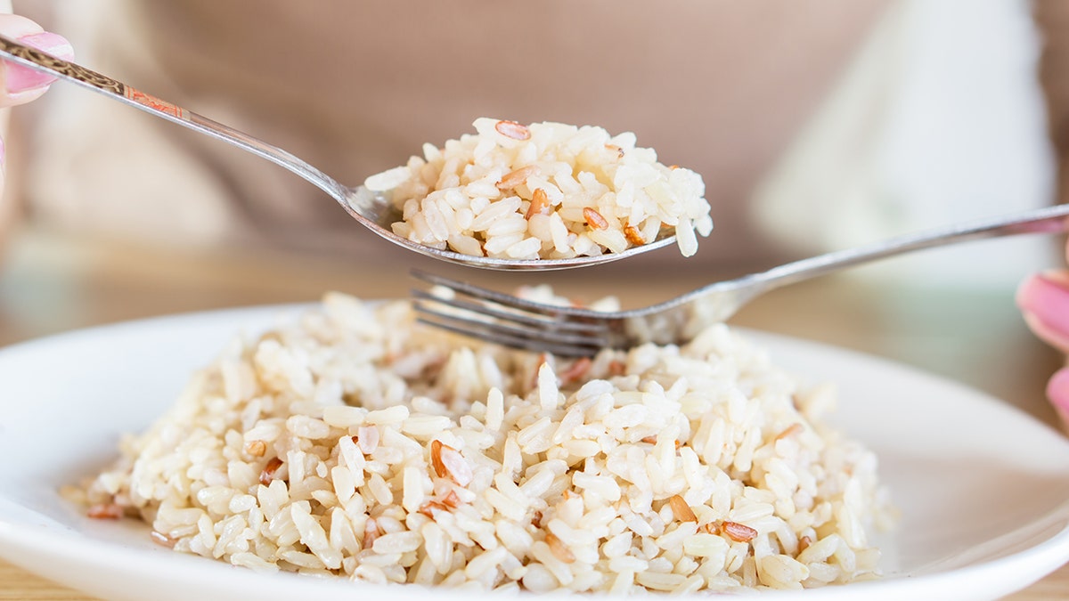 Brown rice on fork
