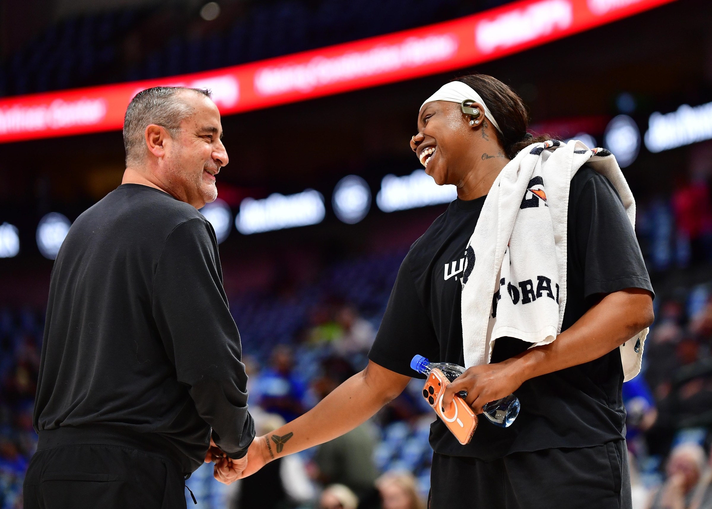 ARLINGTON, TX - JULY 12: Head Coach Jose Fernandez and Arike Ogunbowale #24 of the Dallas Wings smile before the game against the Chicago Sky on July 12, 2026 at American Airlines Center in Dallas, TX. NOTE TO USER: User expressly acknowledges and agrees that, by downloading and or using this photograph, User is consenting to the terms and conditions of the Getty Images License Agreement. Mandatory Copyright Notice: Copyright 2026 NBAE (Photo by Michael Gonzales/NBAE via Getty Images)