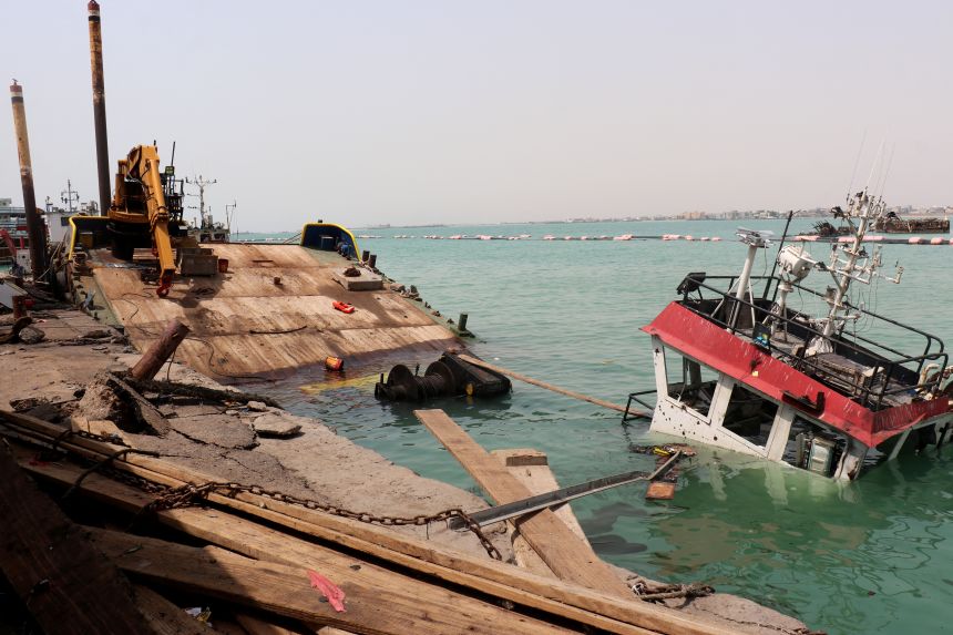 A sunken vessel is seen at the surface of the water in the port of Mocha the day after an attack by the Houthis on August 9, 2026. Strikes by the Iran-backed Houthi rebels have been happening on Yemen's west coast for weeks.