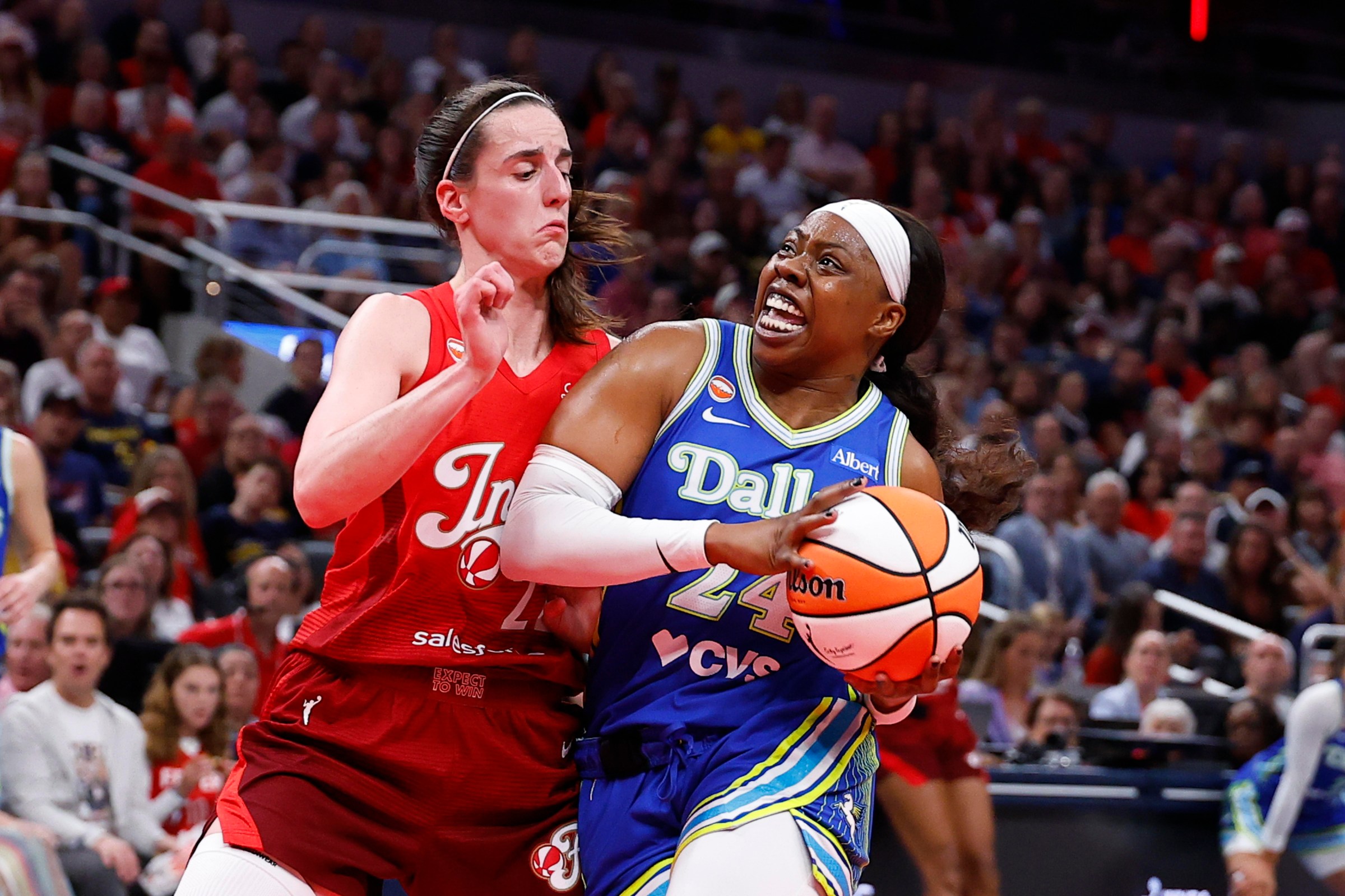 INDIANAPOLIS, IN - AUGUST 14: Dallas Wings guard Arike Ogunbowale (24) drives down the lane while defended by Indiana Fever guard Caitlin Clark (22) in the first half of play during a WNBA game between the Dallas Wings and the against the Indiana Fever on August 14, 2026 at Gainbridge Fieldhouse in Indianapolis, IN. (Photo by Jeffrey Brown/Icon Sportswire via Getty Images)
