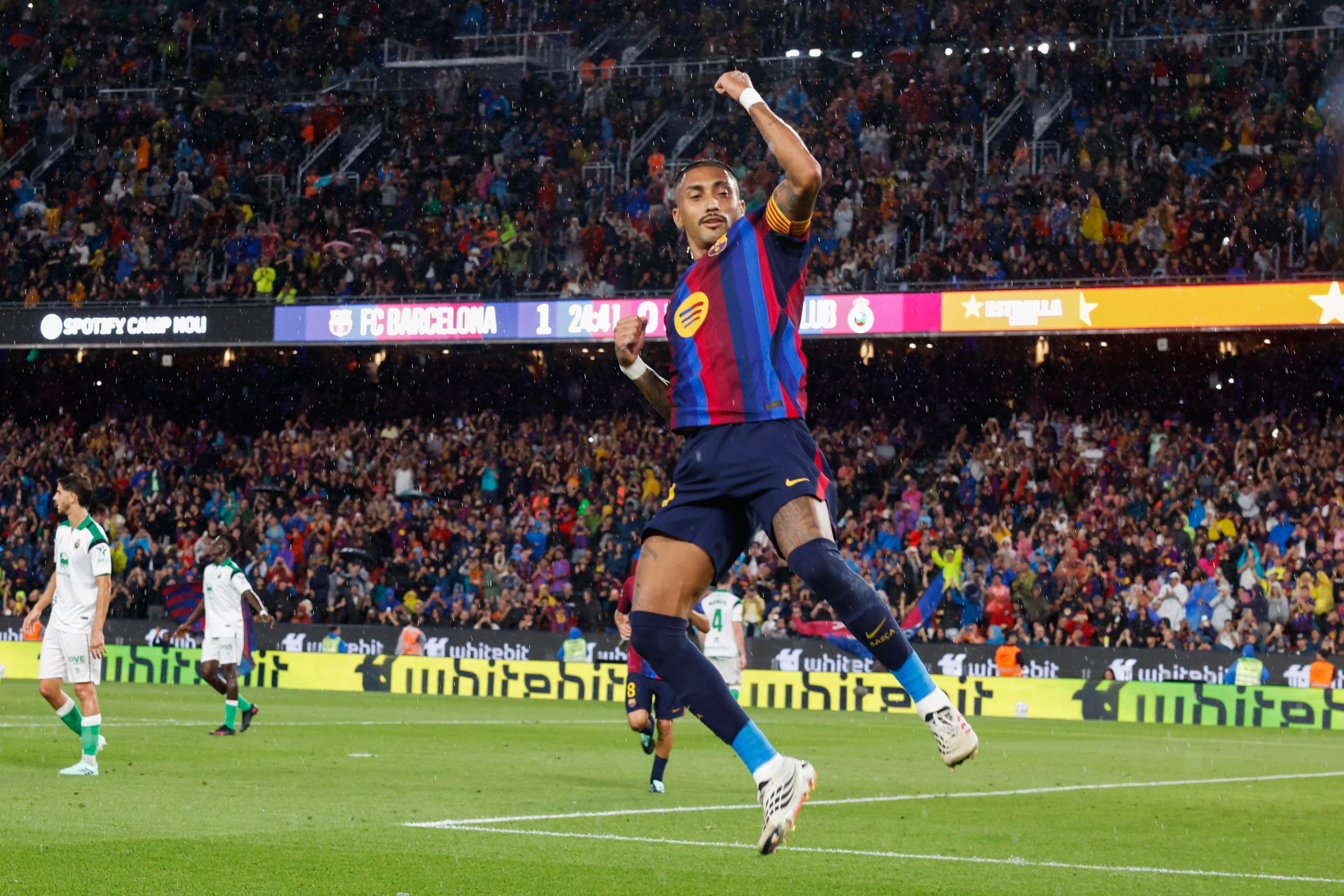 Barcelona’s Brazilian forward #11 Raphinha celebrates scoring his team’s second goal during the Spanish league football match between FC Barcelona and Racing Santander at the Camp Nou stadium in Barcelona on September 16, 2026. (Photo by Lluis GENE / AFP via Getty Images)