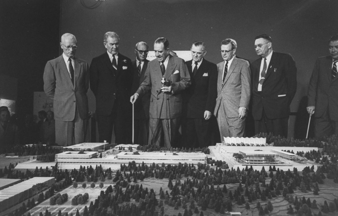On January 1, 1955, US Air Force Secretary Harold Talbott (center), pointed out features on a model of the Air Force Academy that was to be constructed later that year.