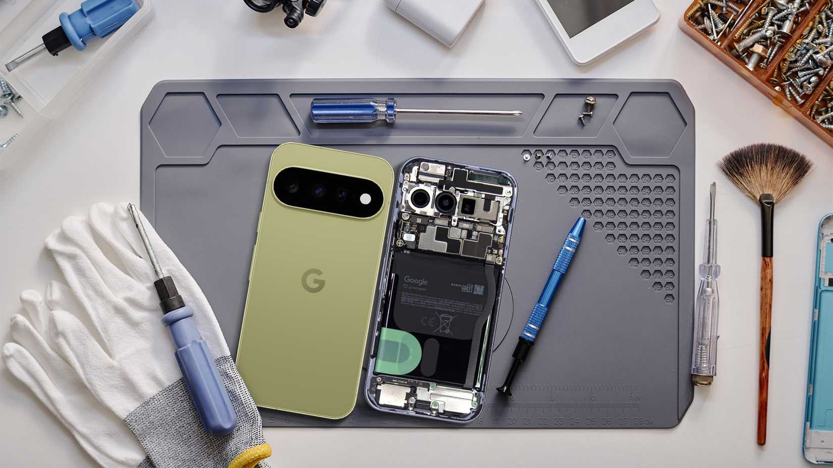 Google Pixel 11 opened for repair with tools and internal components visible