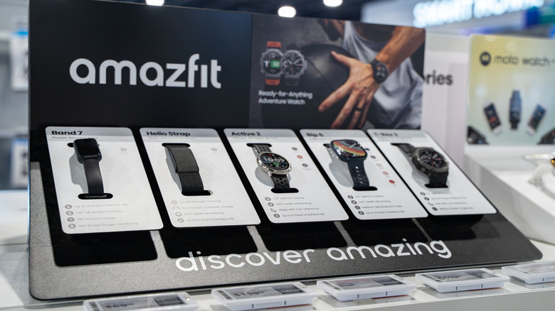 Amazfit retail smartwatch display on a store shelf.