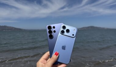 iPhone 18 Pro and Galaxy S26 Ultra on a beach with the ocean in the background.
