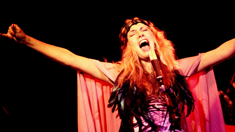 Stevie Nicks onstage with microphone