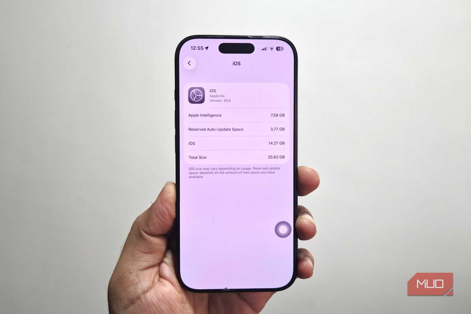 iPhone in hand showing Apple Intelligence storage status