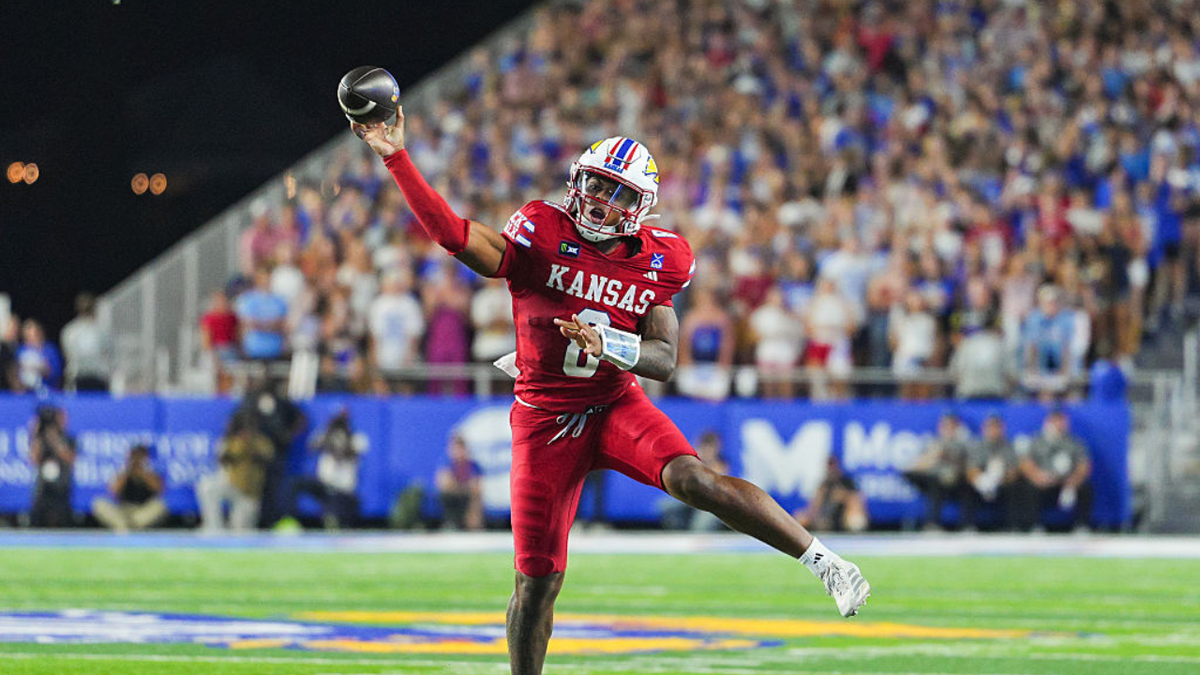 Isaiah Marshall throws a touchdown pass during the first half against Missouri at David Booth Kansas Memorial Stadium.