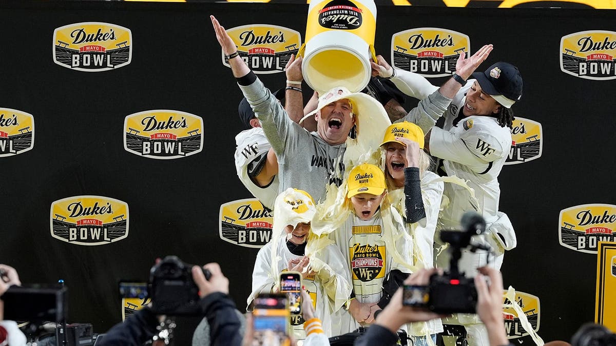 Jake Dickert and his family receive a mayo dump after Wake Forest's win.