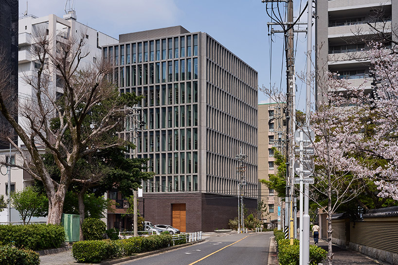 KIAS pairs textured brick facade with planted atrium for headquarters in japan - 1