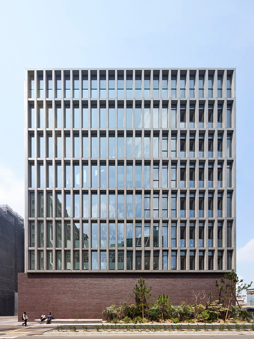 KIAS pairs textured brick facade with planted atrium for headquarters in japan - 2