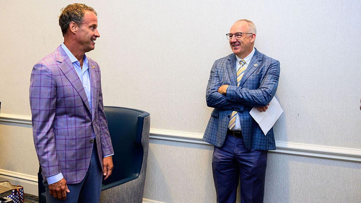 Lane Kiffin and Greg Sankey talk at SEC Media Day 2026 in Tampa.