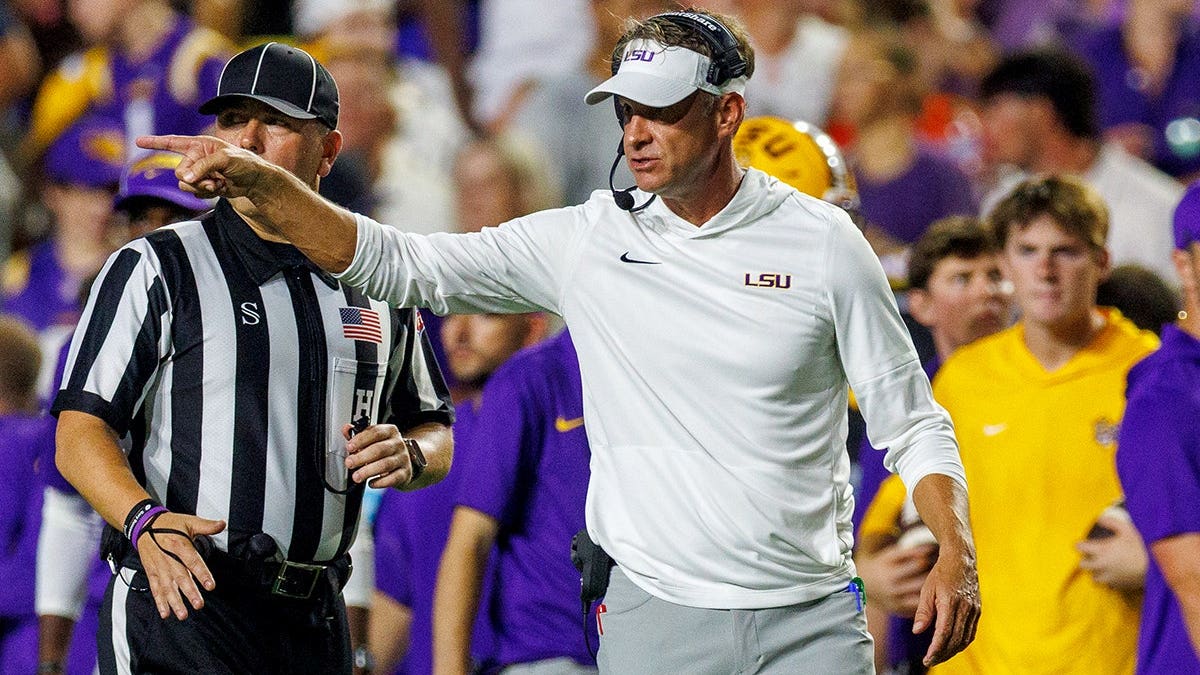 Lane Kiffin, LSU Tigers head coach, reacts during the first half at Tiger Stadium.