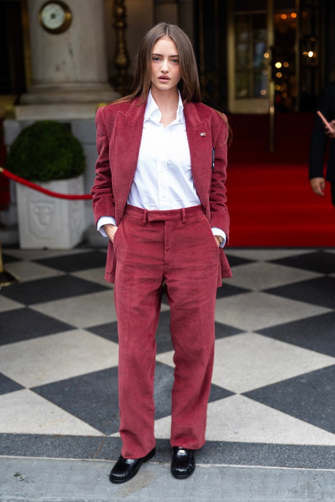 Leni Klum wearing a red corduroy suit over a white shirt.
