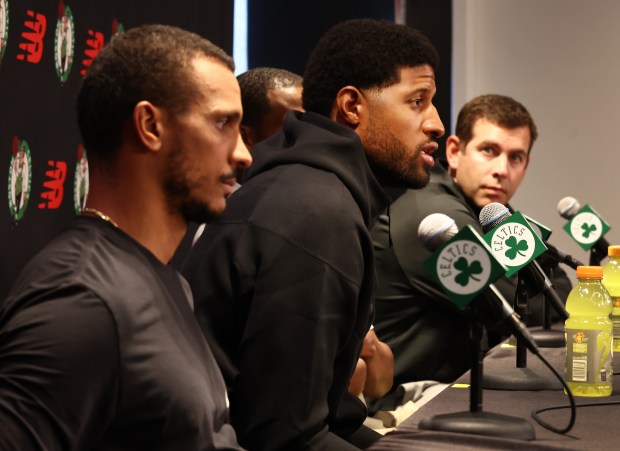 Celtics head coach Joe Mazzulla, left, and President of Basketball Operations Brad Stevens, right, listen to Paul George during a press conference Tuesday. Nancy Lane/Boston Herald