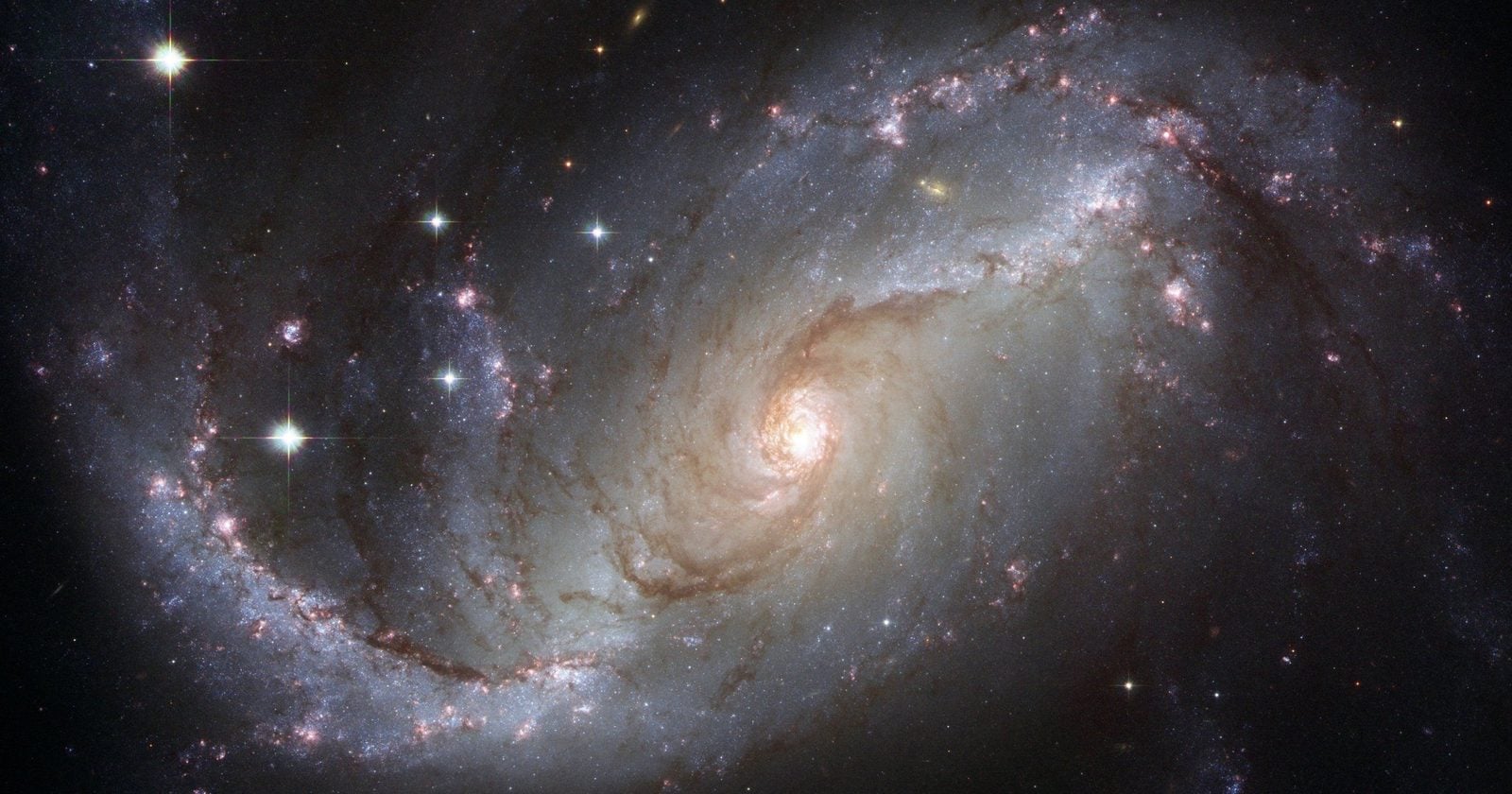 Capture of the NGC 1672 spiral galaxy showcasing its majestic spiral arms and bright core.