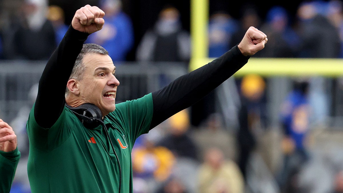 Miami Hurricanes head coach Mario Cristobal reacts after a touchdown against the Pittsburgh Panthers during the third quarter at Acrisure Stadium in Pittsburgh, Pennsylvania, on Nov. 29, 2025.