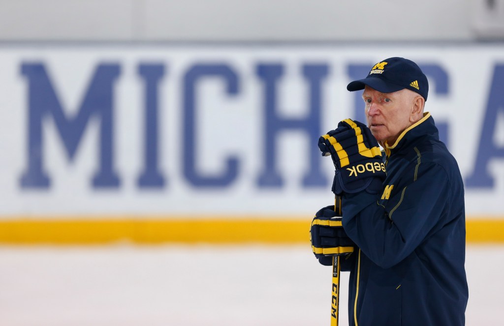Michigan hockey coach Red Berenson on the ice watching practice.