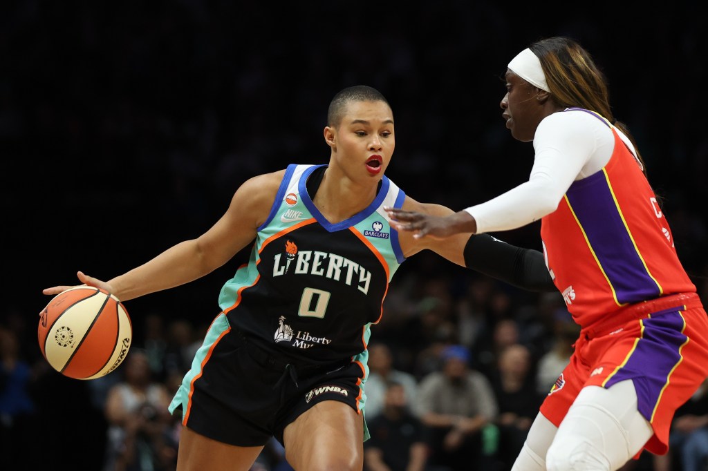 New York Liberty forward Satou Sabally (0) dribbles the ball while Phoenix Mercury guard-forward Kahleah Copper (2) defends during a WNBA game.