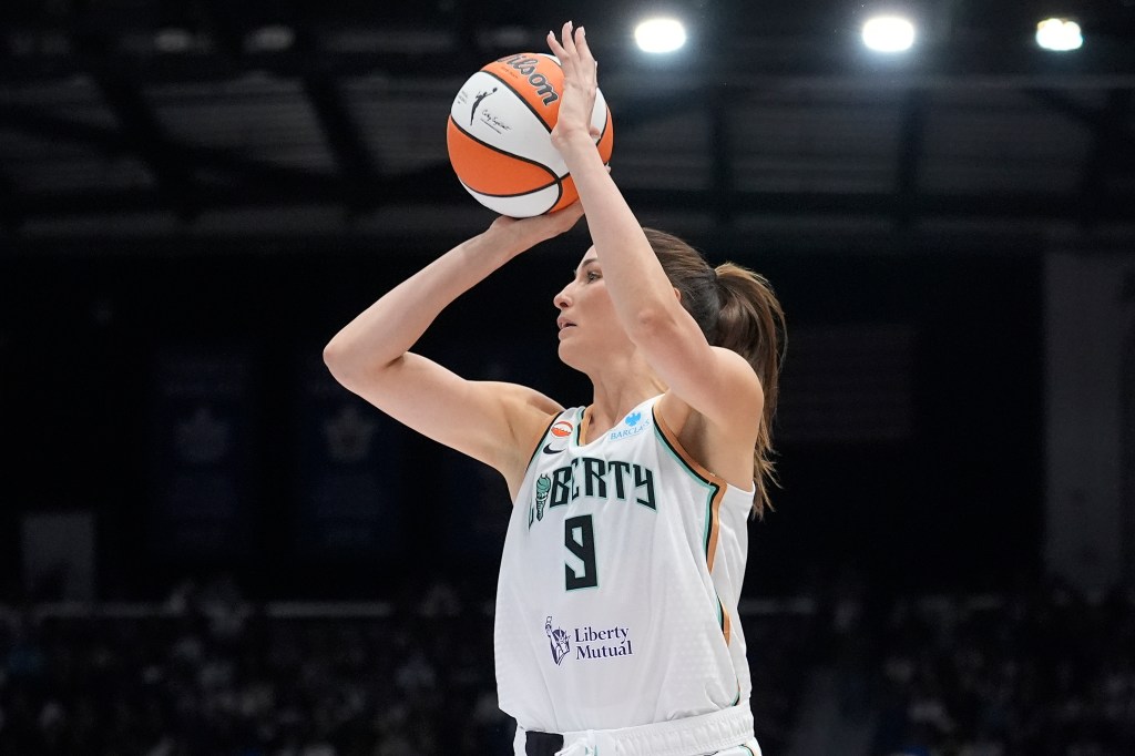 New York Liberty guard Rebecca Allen (9) shoots a three-point basket.