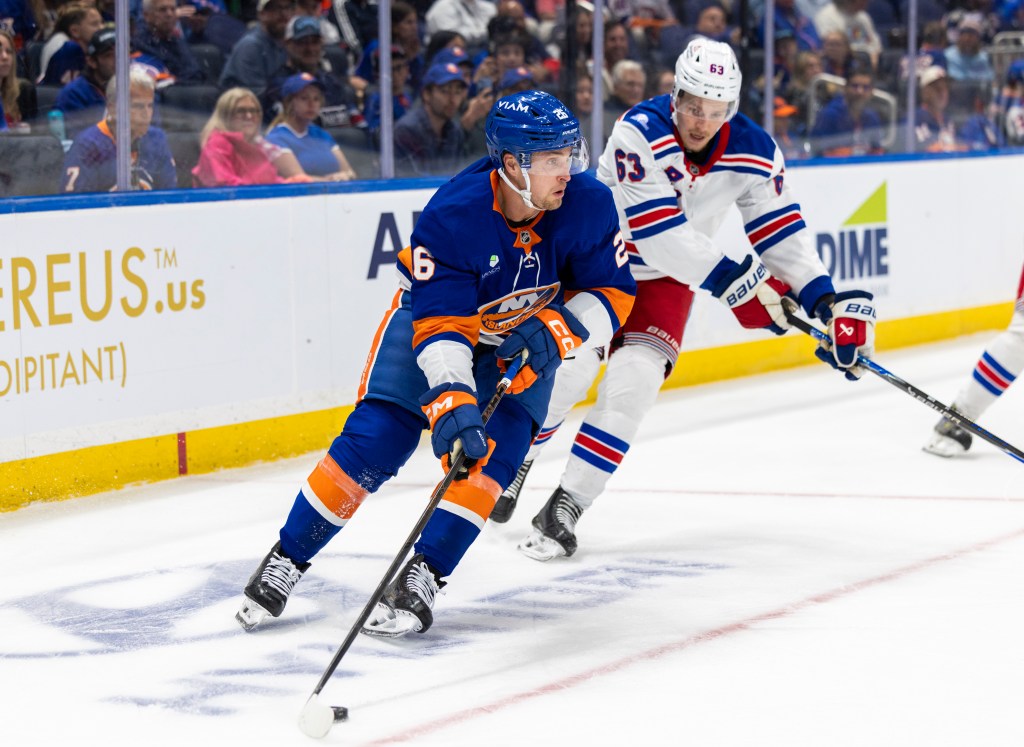 New York Rangers' Alberts Smits pursues New York Islanders' Mitchell Chaffee (26) during the second period.