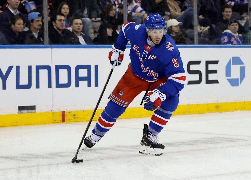 New York Rangers center J.T. Miller moves the puck down ice during the third period at Madison Square Garden in New York, New York, USA, Monday, March 23, 2026.