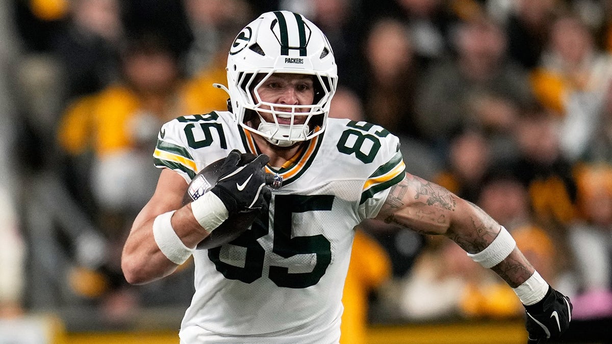 Tucker Kraft of the Green Bay Packers runs with the ball