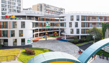 elliptical classroom volumes curve around courtyard kindergarten in hanoi