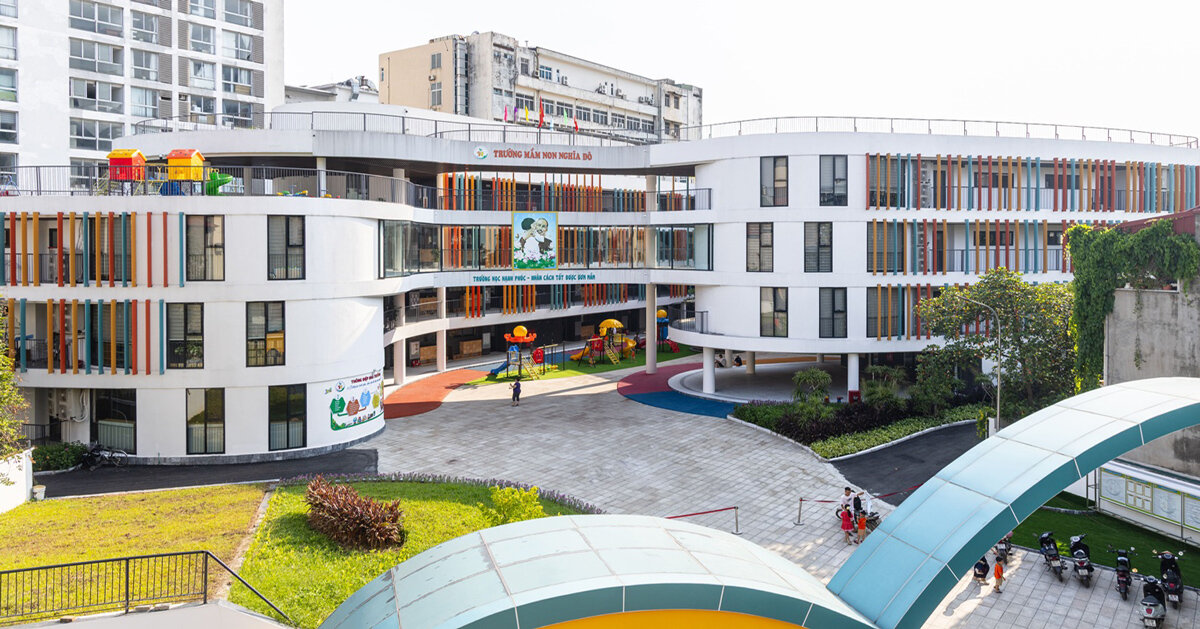 elliptical classroom volumes curve around courtyard kindergarten in hanoi