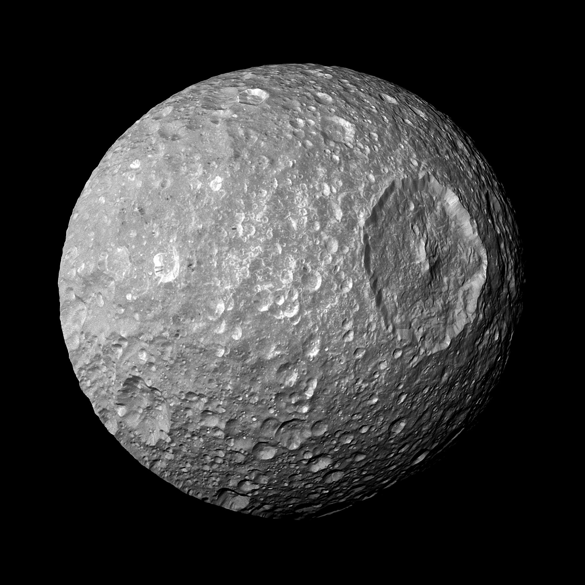 Saturn's moon Mimas is dominated by a huge crater called Herschel that makes the moon look like the Death Star from Star Wars.