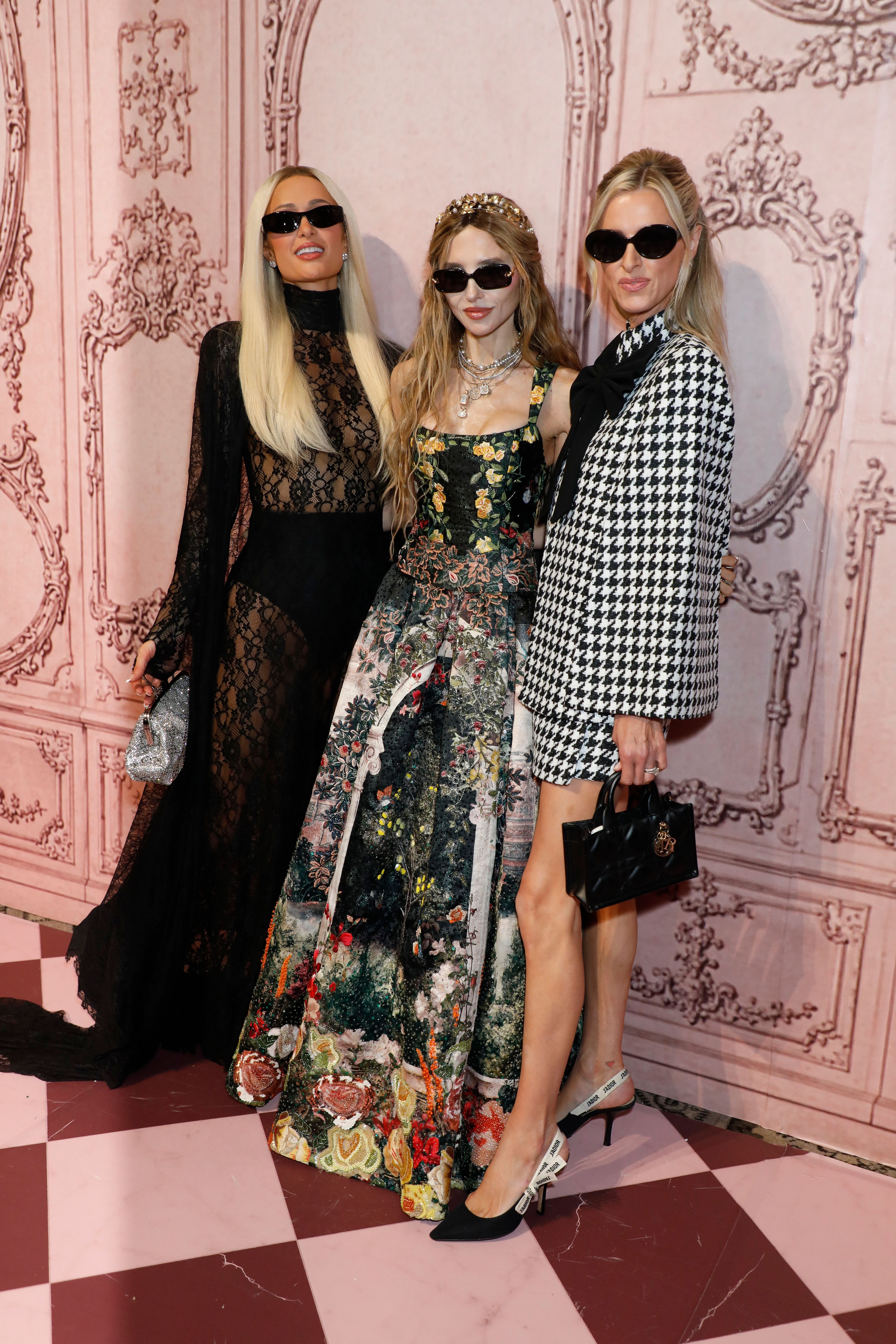 Paris Hilton, Stacey Bendet, and Nicky Hilton posing at the alice & olivia by Stacey Bendet 'Welcome to Wonderland' Presentation.